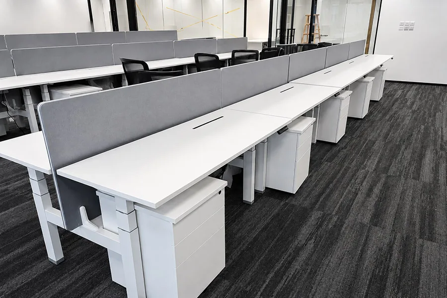 height adjustable workstation tables installed in a commercial office project